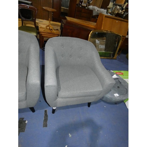 461 - A grey upholstered button back arm chair