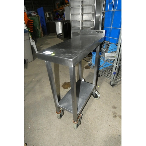 1005 - A mobile commercial stainless steel catering type table with shelf beneath approx 30x70cm