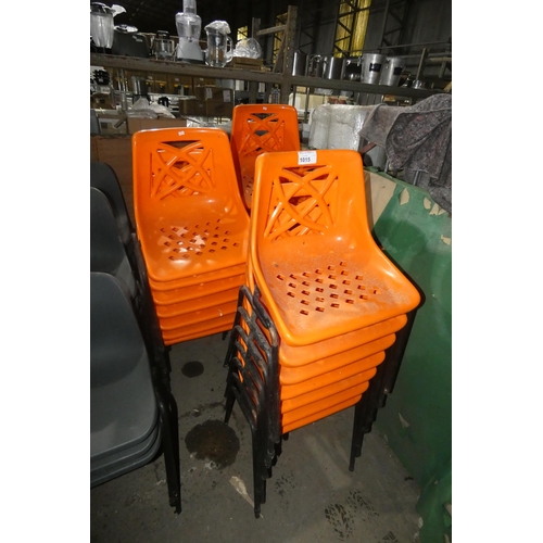 1015 - Approx 30 orange plastic stacking chairs