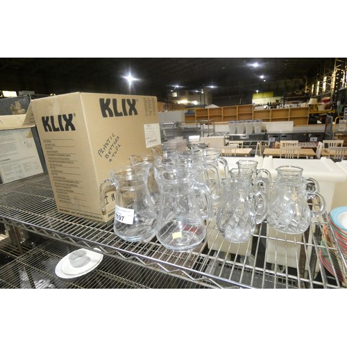 1197 - A quantity of glass water jugs and drinking glasses