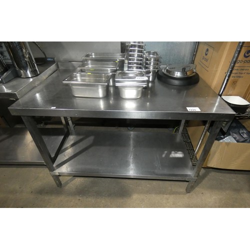 1220 - A commercial stainless steel catering type table with shelf beneath approx 120x70cm