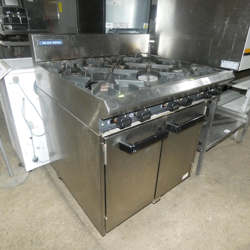 1272 - A commercial stainless steel gas fired 6 burner range with 2 door oven beneath - trade