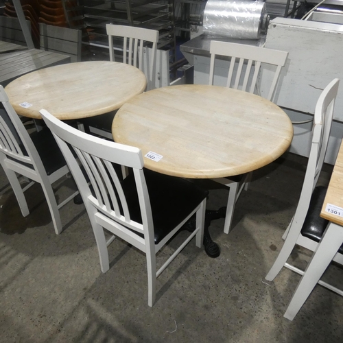 1302 - A round wooden cafe type table approx 80cm and 2 wooden black upholstered chairs