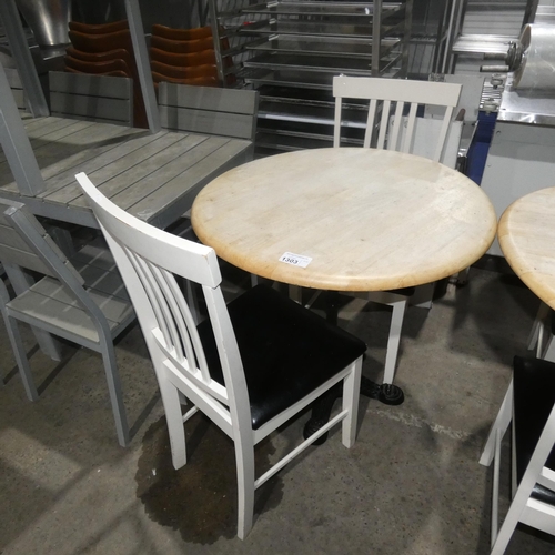 1303 - A round wooden cafe type table approx 80cm and 2 wooden black upholstered chairs