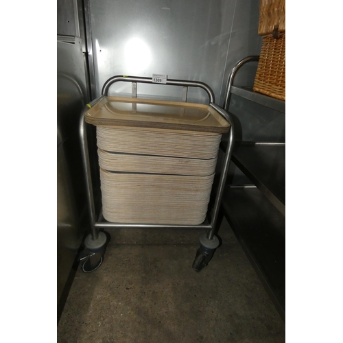 1309 - A mobile tray rack with a large quantity of wooden trays