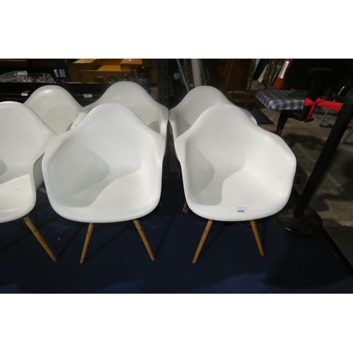 1442 - 4 x white plastic designer style chairs with wood / black metal legs