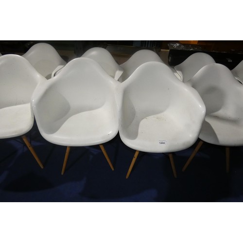 1444 - 4 x white plastic designer style chairs with wood / black metal legs