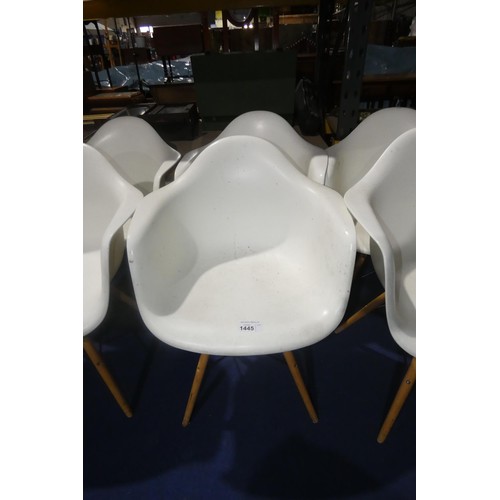 1445 - 2 x white plastic designer style chairs with wood / black metal legs