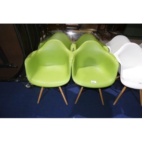 1447 - 4 x green plastic designer style chairs with wood / black metal legs