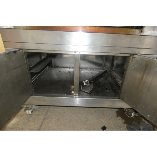 1025 - A large commercial stainless steel pizza oven by Moretti Forni with 2 ovens on a 2 door heated cabin... 