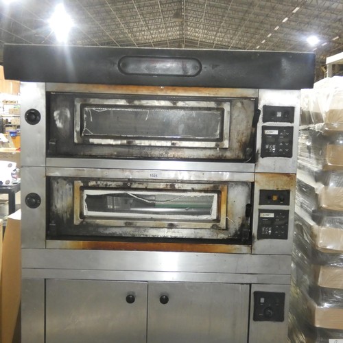 1025 - A large commercial stainless steel pizza oven by Moretti Forni with 2 ovens on a 2 door heated cabin... 