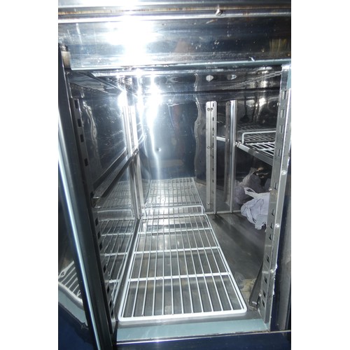 1333 - A mobile commercial stainless steel 2 door bench fridge by Polar no model visible with prep top - tr... 