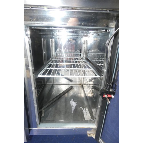 1333 - A mobile commercial stainless steel 2 door bench fridge by Polar no model visible with prep top - tr... 