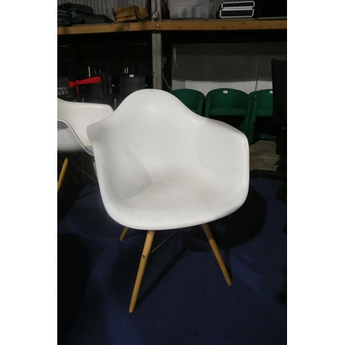 1442 - 4 x white plastic designer style chairs with wood / black metal legs