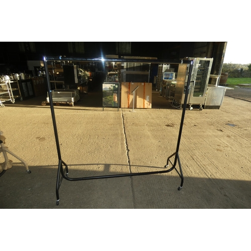 2094 - A metal wheeled clothes rail approx 152cm long