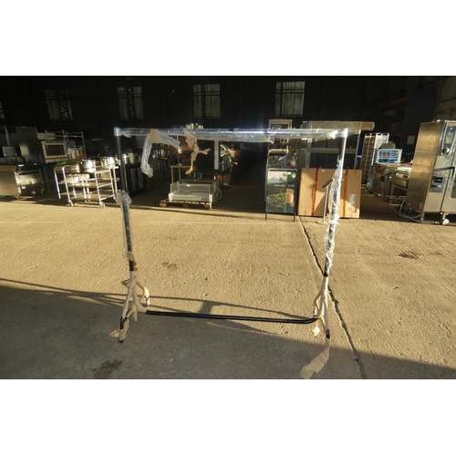 2095 - A metal wheeled clothes rail approx 152cm long