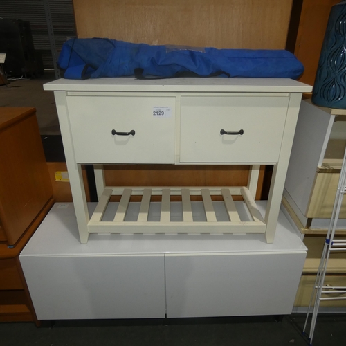 2129 - A white hall type table with 2 drawers, a low white two door cabinet and a folding camping chair