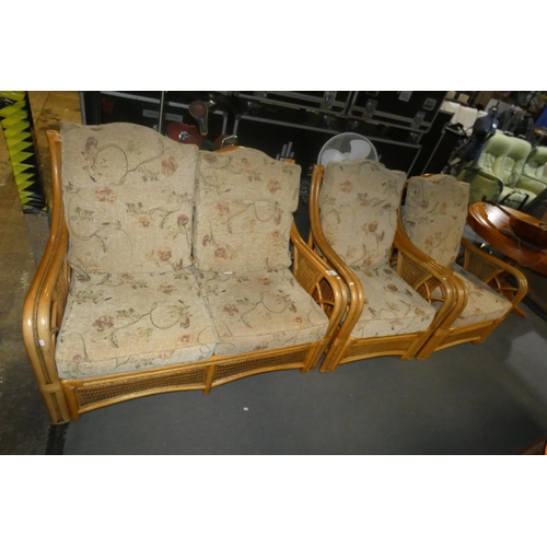 2157 - A conservatory type three piece suite with cushions comprising of a two person sofa and 2 matching c... 