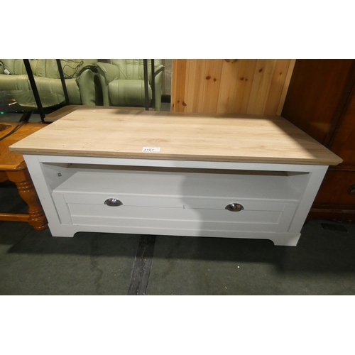 2167 - A modern white and and simulated wood TV stand, approximately 120cm wide.