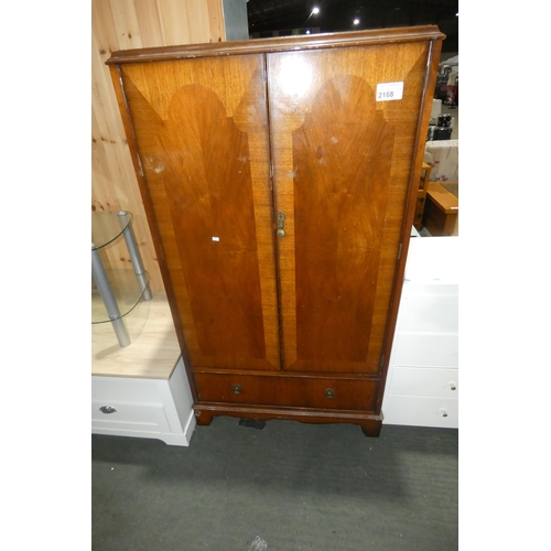 2168 - A vintage dark wood two door wardrobe with 1 drawer beneath approx 85 x 47 x 153cm high