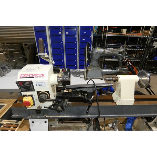 2061 - An Axminster wood turning lathe on stand type AWVSL 1000, 240v supplied with a selection of various ... 