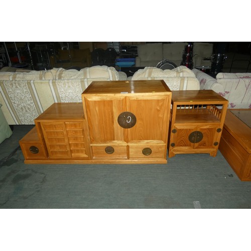 2195 - A Far Eastern style wooden three part cabinet and a matching side cabinet. Main unit comprises of a ... 