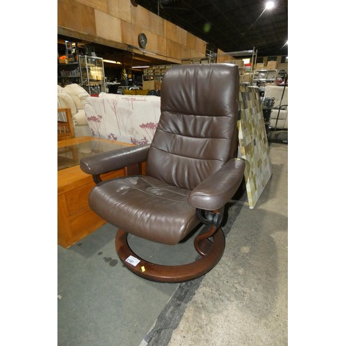 2197 - A Stressless brown upholstered swivelling reclining arm chair (no footstool included) Back height ap... 