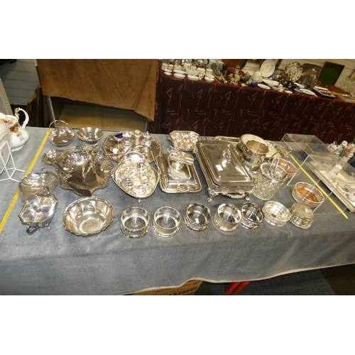 2773 - A silver-plated entree dish, 2 silver-plated baskets, 8 silver plated coasters and a large quantity ... 