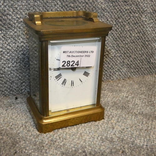 2824 - A small brass cased carriage clock