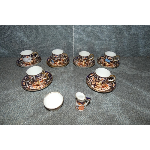 2832 - 6 Imari design Royal Crown Derby coffee cups and saucers and a miniature jug and basin