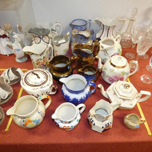 2848 - A collection of miscellaneous decorative jugs and teapots