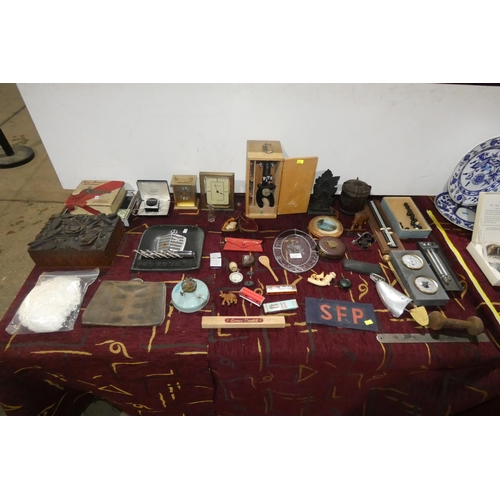 2879 - A small microscope in a wooden box by Tower, a vintage Bakelite tea caddie, several small clocks and... 