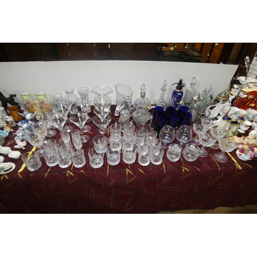 2882 - A vintage blue glass soda syphon, various glass decanters, various decorative glass jugs and vases a... 