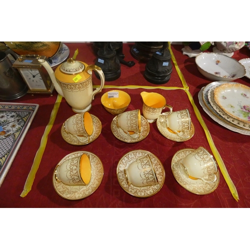 2888 - A small yellow and gilt decorated coffee set