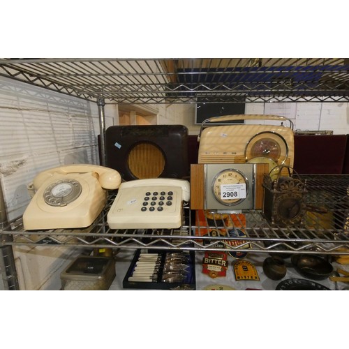 2908 - A vintage Bakelite mains radio, a vintage portable radio, 2 vintage telephone instruments and three ... 