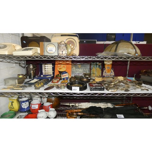 2907 - A large quantity of miscellaneous pub related advertising signs, ashtrays, ornaments and cutlery etc... 