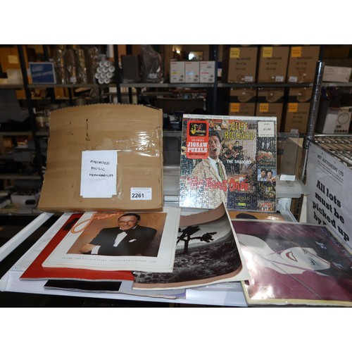 2261 - A quantity of various music memorabilia including a Cliff Richard jigsaw, a Duran Duran 1982 tour po... 