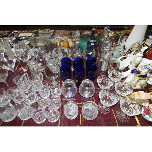 2882 - A vintage blue glass soda syphon, various glass decanters, various decorative glass jugs and vases a... 