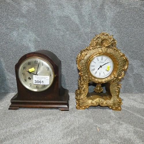 3061 - A decorative gilt coloured mantle clock and a wooden cased domed top mantel clock