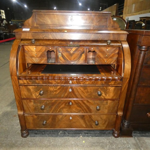 3066 - A fine harewood and mahogany cylinder front Bureau with a fitted interior with secret drawers and co... 