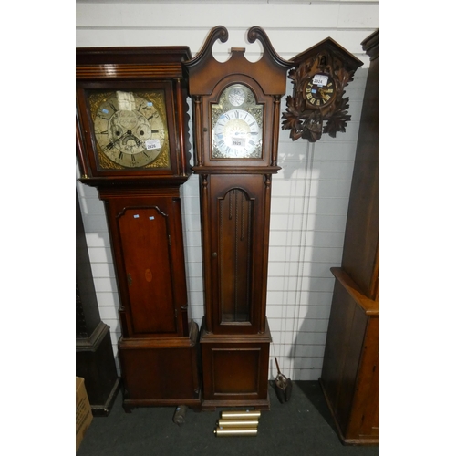 2925 - A reproduction mahogany case grandfather clock with an ornate brass face and brass weights