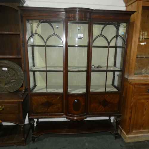 2933 - An Edwardian inlaid mahogany bow front display cabinet with glazed panelled doors enclosing lined sh... 