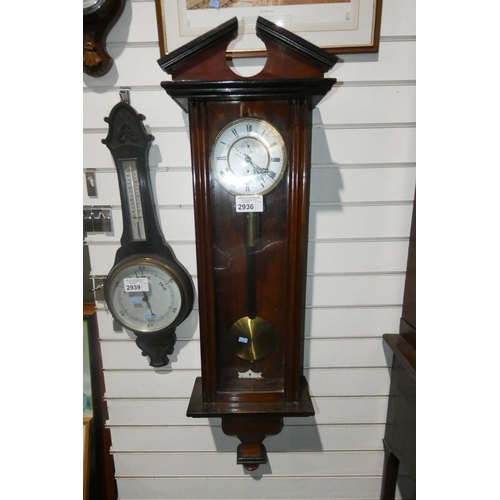 2936 - A Mahogany cased Viennese regulator with a brass weight and pendulum