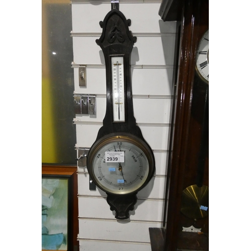 2939 - An Aneroid barometer and mercury thermometer in an oak case