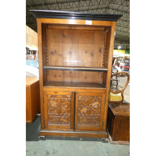 2959 - A carved dark wood open fronted bookcase with 2 shelves and doors under, approximately 92 cm wide