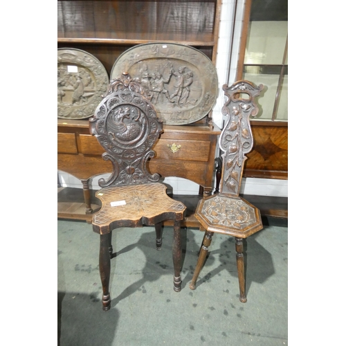 2964 - A carved oak spinning chair with an octagonal seat and a heavily carved oak hall chair