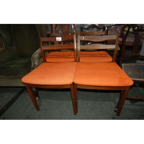 2973 - A set of four 1970s vintage teak dining chairs with orange upholstered seats