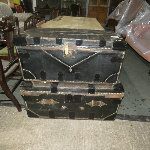 2981 - 2 vintage studded storage trunks each with a lift lid