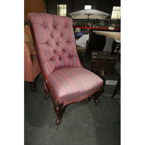 2984 - A Victorian mahogany striped upholstered button back lady's chair on cabriole legs