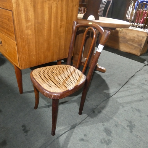 2990 - A child's antique Thonet bentwood chair with a cane seat